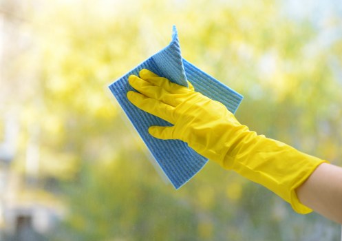 Local window cleaner working on a Highbury apartment building