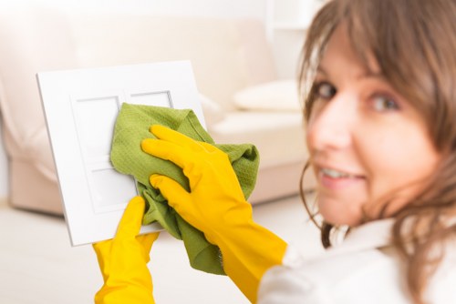 Technician using PPE during professional carpet cleaning
